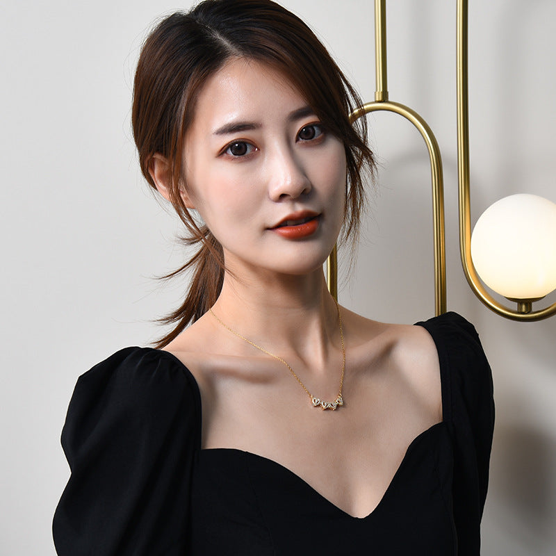 A new two-wear heart-to-heart female opening and closing four-leaf clover necklace fashion love folding creative collarbone chain wholesale